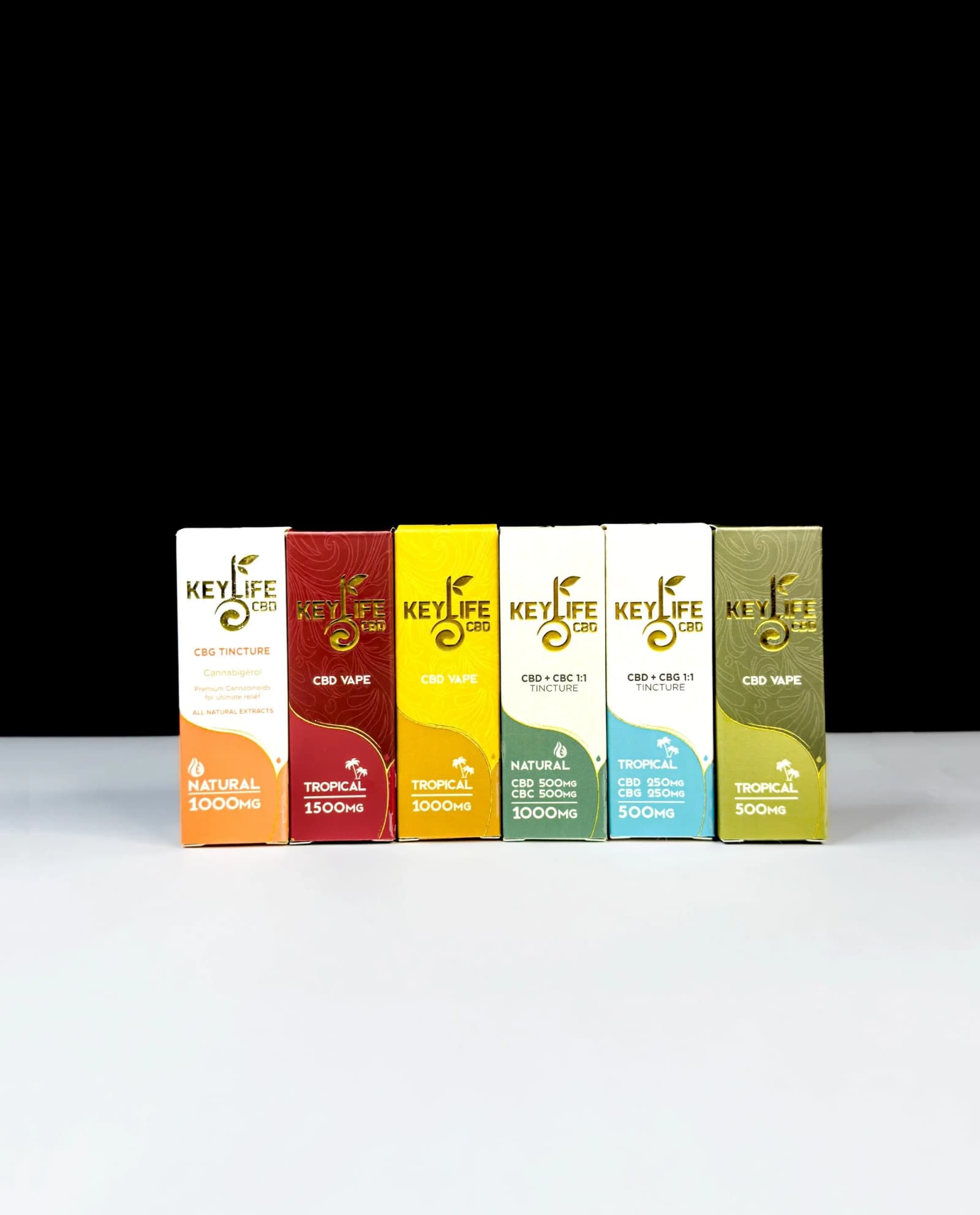 Custom CBD tincture boxes with gold foil branding, stacked