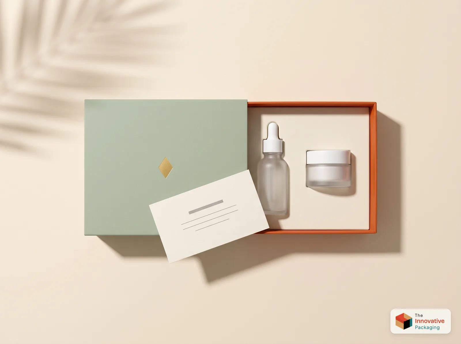 A sage tray and sleeve box sliding open to reveal a bright orange printed interior with a serum bottle and jar in a fitted insert and a printed card